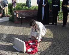 Hospital representative laying wreath at Gosport War Memorial